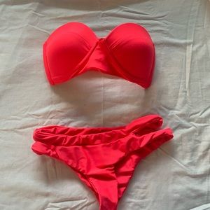 MIKOH red swimsuit top and bottom.